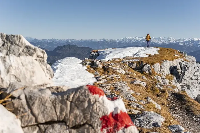 Framed Print : Mountaineer looks over snow-covered mountains