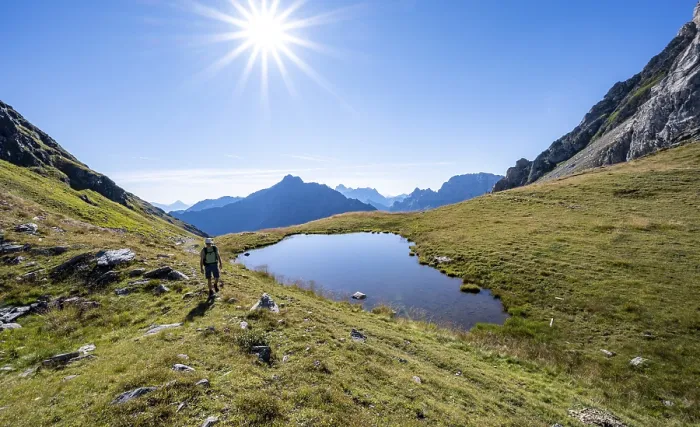 Framed Print : Mountaineer at a mountain lake