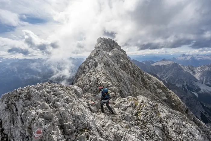 Framed Print : Mountaineer on a narrow rocky ridge Framed Print : Mountaineer on a narrow rocky ridge
