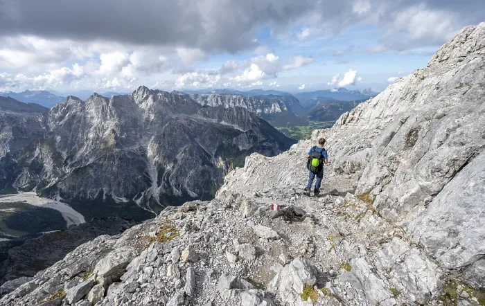 Framed Print : Mountaineer on a narrow rocky ridge