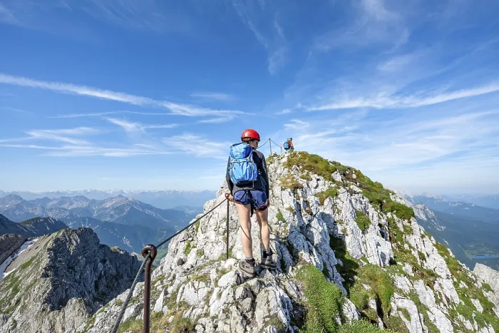 Framed Print : Mountaineer on a ridge on a secured via ferrata