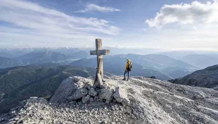 Framed Print : Mountaineer at a secondary peak of the Hochkoenig with summit cross Framed Print : Mountaineer at a secondary peak of the Hochkoenig with summit cross