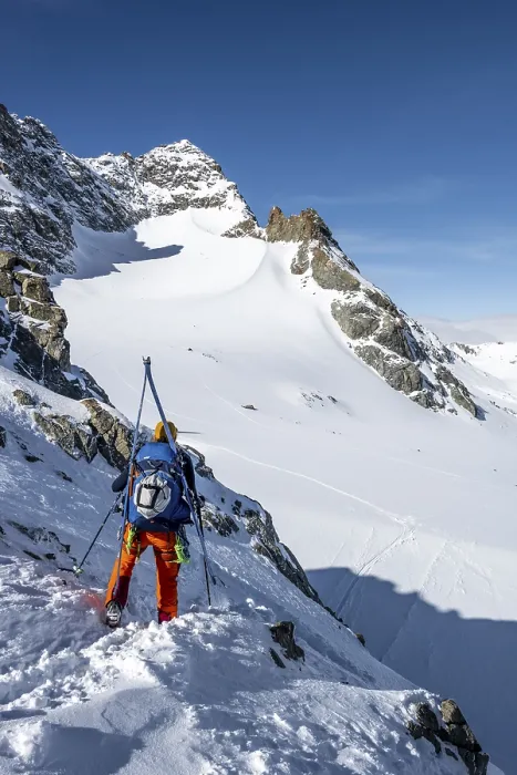 Framed Print : Mountaineer with skis at the fork Porta d'Es-cha