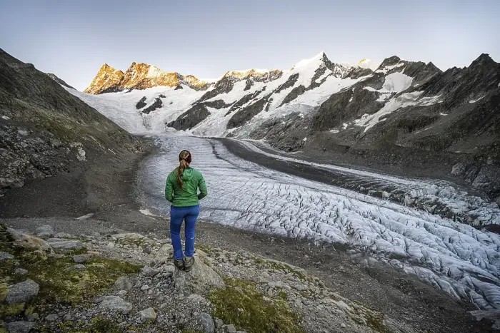 Framed Print : Mountaineer standing in front of glacier