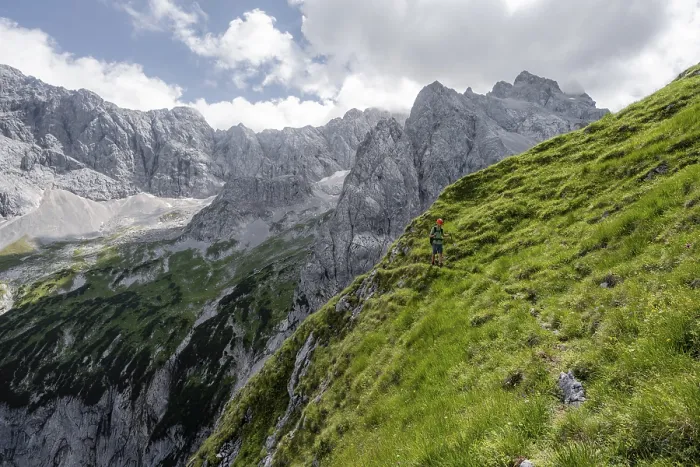 Framed Print : Mountaineer in steep terrain on the Schafsteig on the Waxenstein ridge
