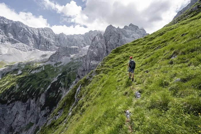 Framed Print : Mountaineer in steep terrain on the Schafsteig on the Waxenstein ridge