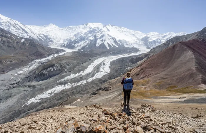 Framed Print : Mountaineer at Traveller's Pass with view of impressive mountain landscape