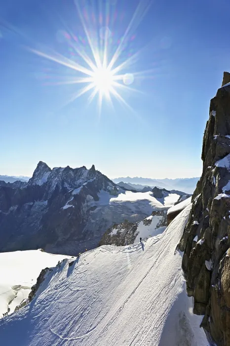 Framed Print : Mountaineers climb over a snow-covered ridge