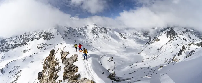 Framed Print : Three mountaineers climbing the narrow ridge of Piz Laviner