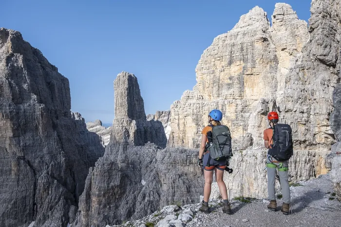 Framed Print : Mountaineers look at Campanile Alto pinnacle