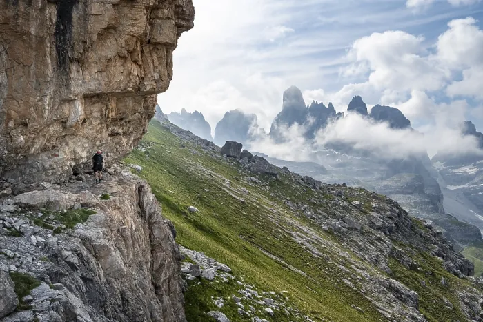Framed Print : Mountaineers on a trail in front of picturesque mountain landscape with rocky peaks Framed Print : Mountaineers on a trail in front of picturesque mountain landscape with rocky peaks