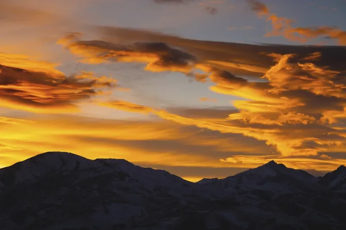 Framed Print : Mountains in the clouds at sunset in summer