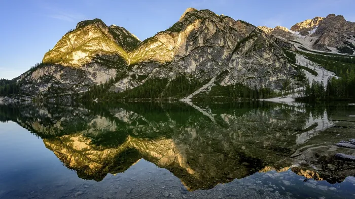 Framed Print : Mountains in the evening light are reflected in Lake Prags Lake