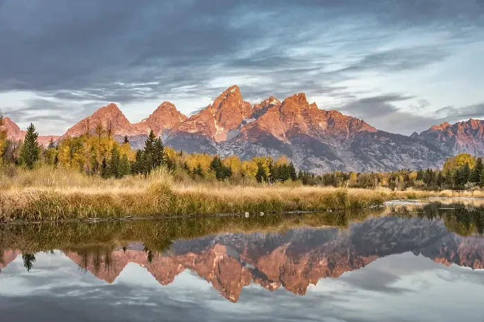 Framed Print : Mountains glow red at sunrise, Grand Teton Range mountain range reflected in the river Framed Print : Mountains glow red at sunrise, Grand Teton Range mountain range reflected in the river