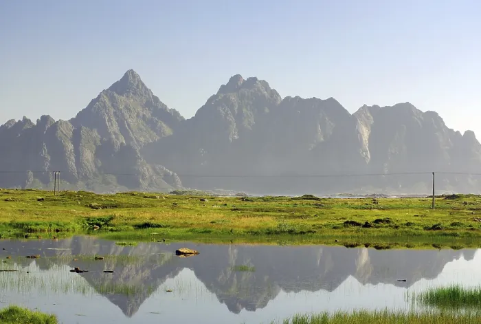 Framed Print : Mountains reflected in a calm body of water