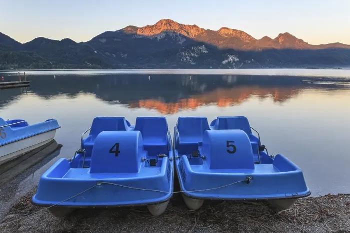 Framed Print : Mountains reflected in lake, pedal boats