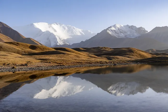 Framed Print : Mountains reflected in a small mountain lake