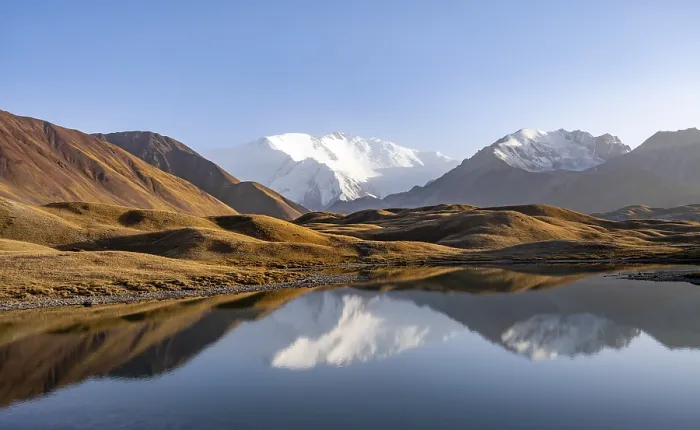 Framed Print : Mountains reflected in a small mountain lake