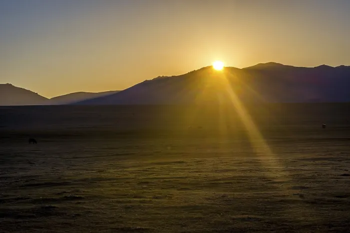 Framed Print : Mountains around Song Kul lake and horses in a sunrise sun