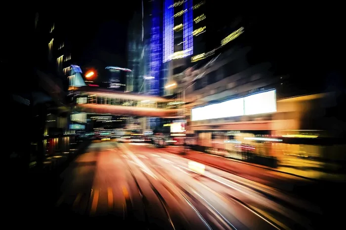 Framed Print : Moving through modern city street with illuminated skyscrapers Framed Print : Moving through modern city street with illuminated skyscrapers