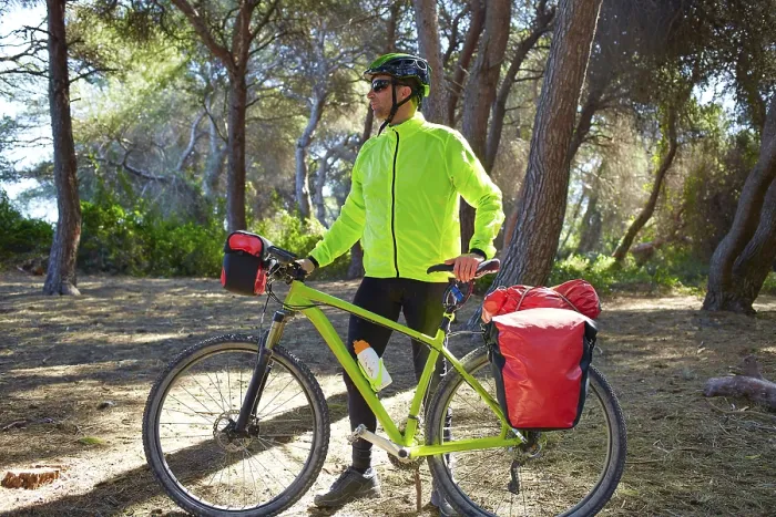 Framed Print : MTB Biker Bicycle touring in a pine forest with pannier racks and saddlebag