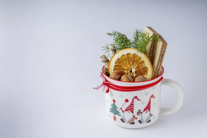 Framed Print : A mug with dry orange, nuts, waffles