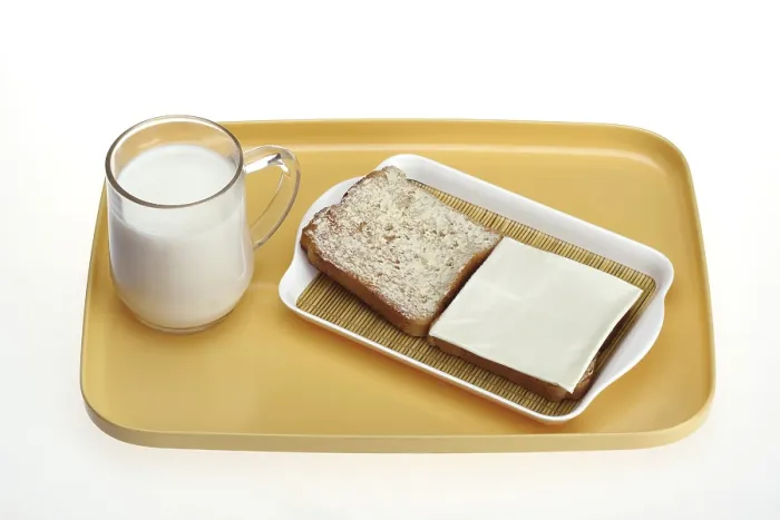 Framed Print : Mug of milk with bread toast with butter spread and cheese slice