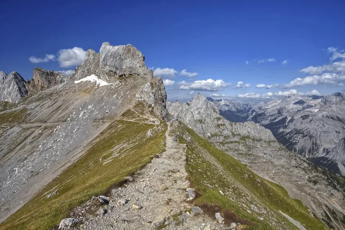 Framed Print : A narrow hiking trail leads over a mountain ridge