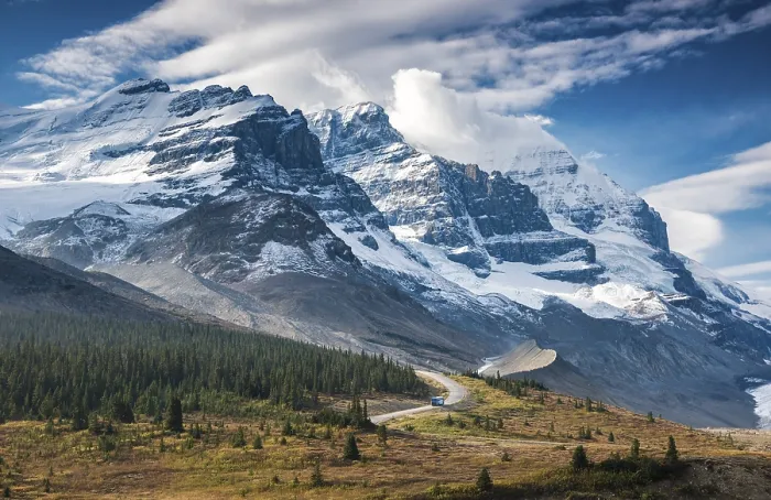 Framed Print : Narrow road with bus in front of spectacular mountain scenery Framed Print : Narrow road with bus in front of spectacular mountain scenery