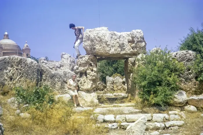 Framed Print : Neolithic temples of Skorba prehistoric archaeological site, Mgarr, Malta, Europe 1971 young man climbing on stones, Europe