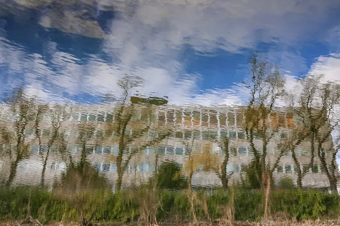 Framed Print : New town hall reflected in the river Mur