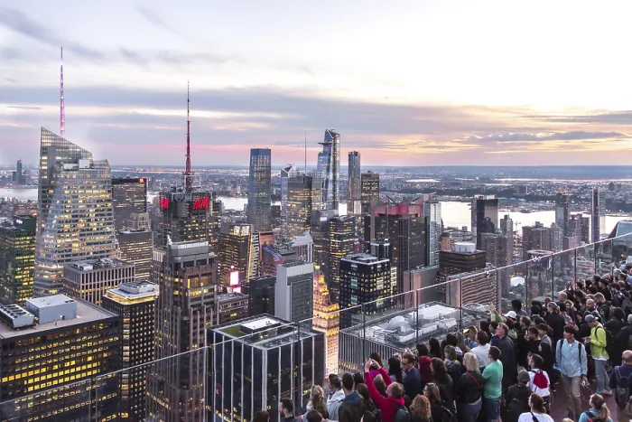 Framed Print : NEW YORK, USA - 17 MAY, 2019: Tourists taking pictures from a rooftop on Manhattan skyscraper rockefeller center