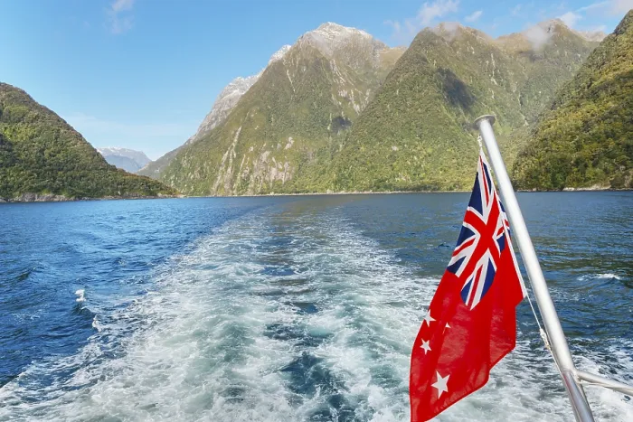 Framed Print : New Zealand flag waving, Milford Sound