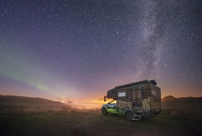 Framed Print : Night shot of a painted camper van under the Milky Way with northern lights