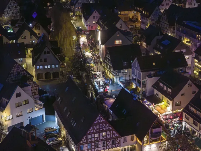 Framed Print : Night view of a village with illuminated half-timbered houses and roads Framed Print : Night view of a village with illuminated half-timbered houses and roads