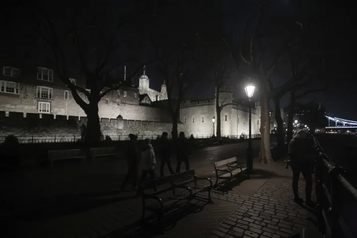 Framed Print : A nighttime view of a historic castle with a path lined by benches and lamps at The Tower of London Framed Print : A nighttime view of a historic castle with a path lined by benches and lamps at The Tower of London