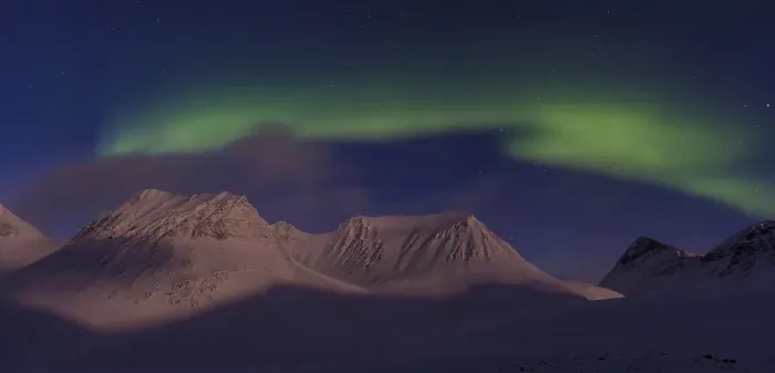 Framed Print : Northern Lights (Aurora borealis) over moonlit mountains in the valley Stuor Reaiddavaggi