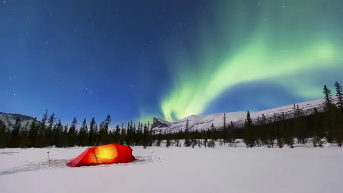 Framed Print : Northern Lights (Aurora borealis) above a red illuminated tent in winter Framed Print : Northern Lights (Aurora borealis) above a red illuminated tent in winter