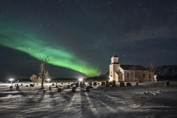 Framed Print : Northern lights over cemetery and church of Gimsoy