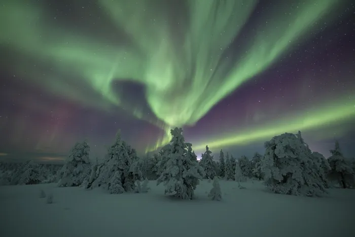Framed Print : Northern lights over winter landscape