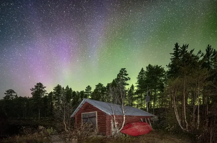 Framed Print : Northern lights above a wooden cabin in a Nordic forest Framed Print : Northern lights above a wooden cabin in a Nordic forest