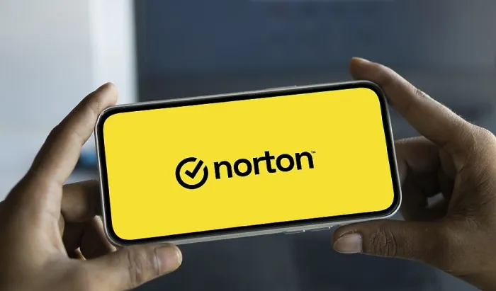 Framed Print : norton logo is displayed on smartphone
