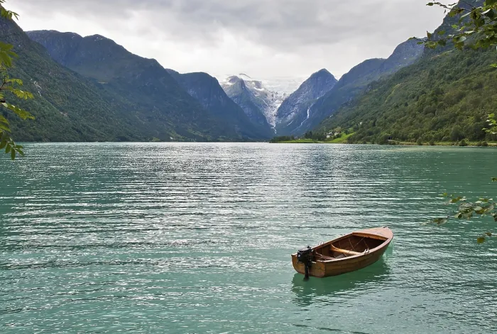 Framed Print : The Norwegian landscape with a boat on lake against mountains