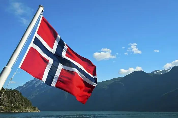 Framed Print : Norwegian national flag, ship in the Geiranger fjord Framed Print : Norwegian national flag, ship in the Geiranger fjord