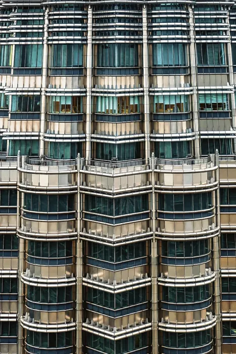 Framed Print : Nov 20, 2019 - Kuala Lumpur, Malaysia: Symmetrical close-up of Petronas Towers facade with metallic surfaces