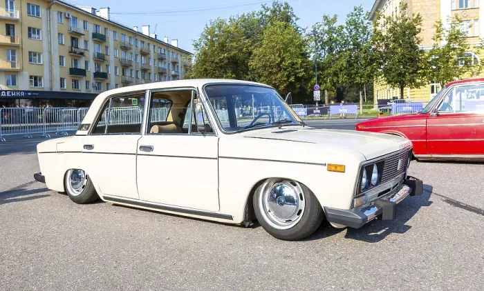 Framed Print : Novgorod, Russia - August 31, 2024: Vintage soviet tuned Lada-2103 lowered suspension vehicle at the city street
