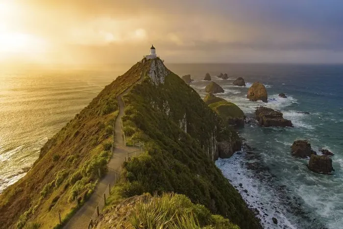 Framed Print : Nugget Point and lighthouse with sunrise at South Island