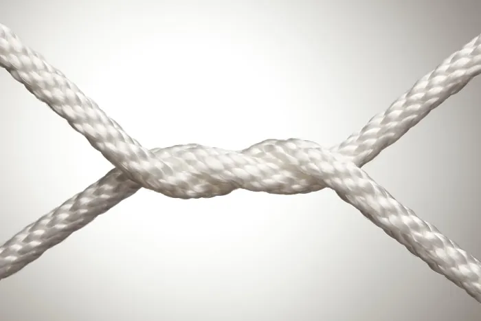 Framed Print : Nylon rope knot on a spot lit background Framed Print : Nylon rope knot on a spot lit background
