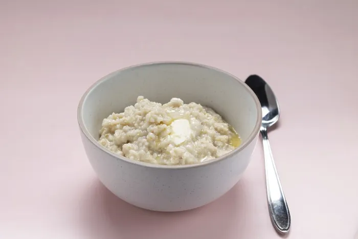 Framed Print : Oatmeal with butter in a white plate