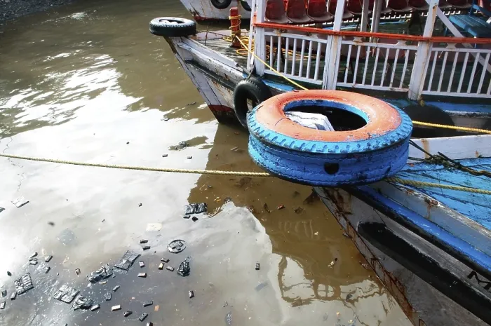 Framed Print : Oil floating at ferry boats due to container ship chitra colliding in sea Bombay Mumbai
